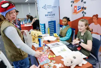 three students working around a table